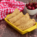 Air Fryer Cherry Hand Pies -- Are you looking for an easy and delicious dessert that will wow your guests? Look no further than these air fryer cherry hand pies. Not only are they beautiful to behold, but the combination of sweet-tart cherries encased in buttery puff pastry is divine. Furthermore, you can make them quickly and easily with just a few simple ingredients and an air fryer – there’s barely any mess! So, if you’re ready to bypass laborious baking time for a delectable treat, read on as we guide you through making these yummy delights!