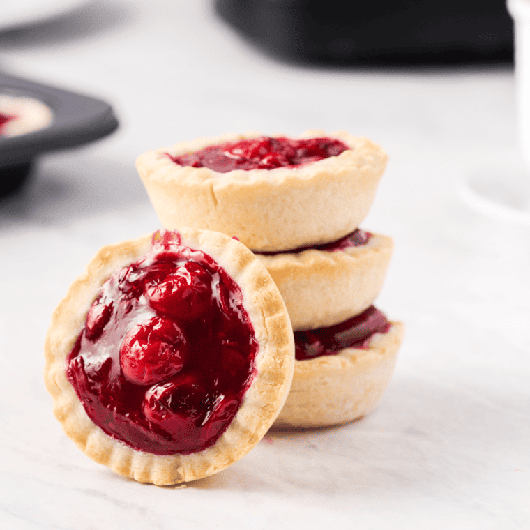 Perfectly portioned Air Fryer Cherry Tarts with a golden, flaky crust and sweet cherry filling.