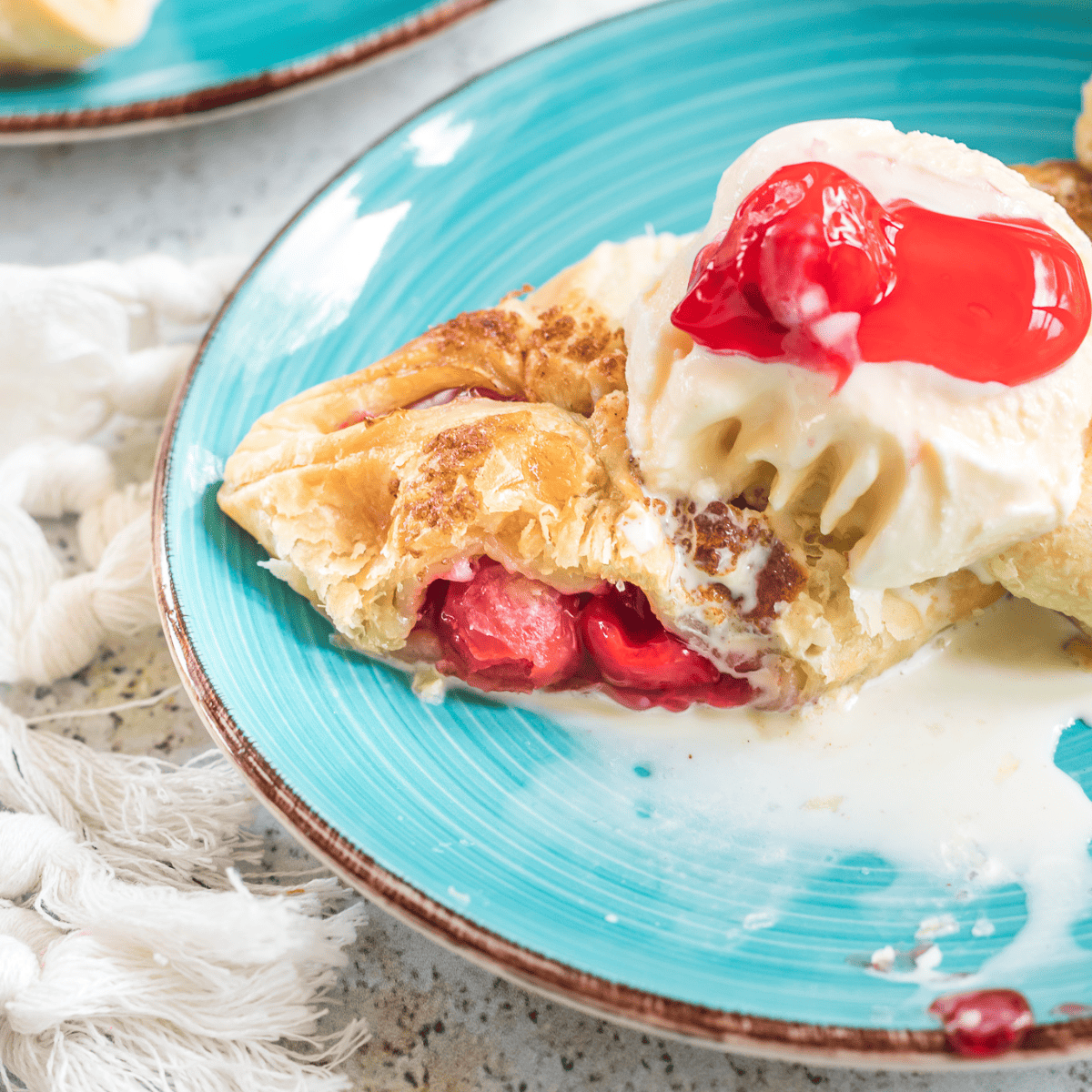 Experimenting with different variations of cherry turnovers can add exciting new flavors and textures to this classic treat. Here are some creative ideas to try: Mixed Berry Turnovers: Combine cherry pie filling with other berries like blueberries, raspberries, or blackberries for an eclectic berry twist. Chocolate Cherry Turnovers: Add a few chocolate chips or a small spoonful of chocolate spread to the cherry filling for a decadent chocolate cherry combination. Almond Cherry Turnovers: Mix in some almond extract or chopped almonds with the cherry filling for a nutty flavor that pairs well with cherries. Lemon Glazed Cherry Turnovers: After baking, drizzle a simple lemon glaze made from powdered sugar and lemon juice over the turnovers for a tangy finish. Cream Cheese Cherry Turnovers: Add a dollop of cream cheese to the cherry filling before sealing the turnovers for a creamy texture. Spiced Cherry Turnovers: Spice up the cherry filling with cinnamon, nutmeg, or allspice for a warm and aromatic flavor. Cherry and Apple Turnovers: Combine diced apples with cherry pie filling for a sweet and slightly tart flavor. Savory Cherry Turnovers: Mix the cherry filling with goat cheese and thyme for a savory twist. This combination is unexpectedly delicious and offers a gourmet experience. Vanilla Bean Cherry Turnovers: Infuse the cherry filling with the seeds of a vanilla bean or a splash of vanilla extract for a subtle, fragrant flavor. Cherry and Peach Turnovers: Mix cherry filling with diced peaches for a summery, sweet turnover. These variations on the classic cherry turnover allow you to play with flavors and textures, creating new and exciting combinations to suit any taste preference.