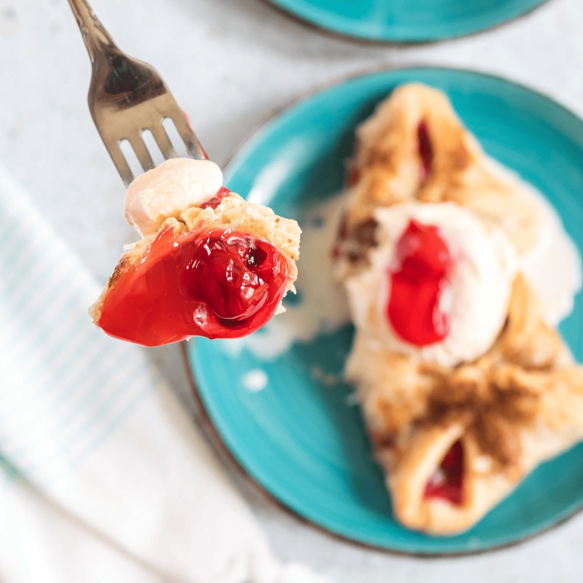 Creating perfect cherry turnovers in an air fryer can be a delightful experience. Here are some pro tips to ensure they turn out delicious every time: Puff Pastry Handling: Keep the puff pastry dough cool but not frozen for easy handling. If it gets too warm, it can become sticky and difficult to work with. Avoid Overfilling: Be careful not to overfill the turnovers. Too much filling can cause them to burst open during cooking, leading to a messy air fryer. Seal Edges Properly: Use a fork to crimp the turnovers' edges tightly. This helps prevent the filling from leaking out during air frying. Egg Wash for Golden Color: Brush the turnovers with an egg wash before cooking. This gives them a beautiful golden color and helps the sugar topping stick. Preheat the Air Fryer: Always preheat your air fryer briefly before adding the turnovers. This helps to cook them evenly and achieve a crispy exterior. Cook in Batches: Don't overcrowd the air fryer basket. Cook in batches if necessary to allow for proper air circulation, which is key to achieving a crispy texture. Monitor Cooking Time: Keep an eye on the turnovers as they cook. Air fryer temperatures can vary, so adjust the cooking time accordingly. Let Them Cool: Allow the turnovers to cool for a few minutes after air frying. The filling will be extremely hot right out of the air fryer. Adjust Sweetness: Tailor the sugar topping amount based on your sweetness preference. Storing and Reheating: If you have leftovers, store them in an airtight container. Reheat in the air fryer for a few minutes to maintain the crispiness. By following these tips, you'll be able to make Air Fryer Cherry Turnovers that are as delicious as they are easy to prepare, with a perfect balance of flaky pastry and sweet cherry filling.