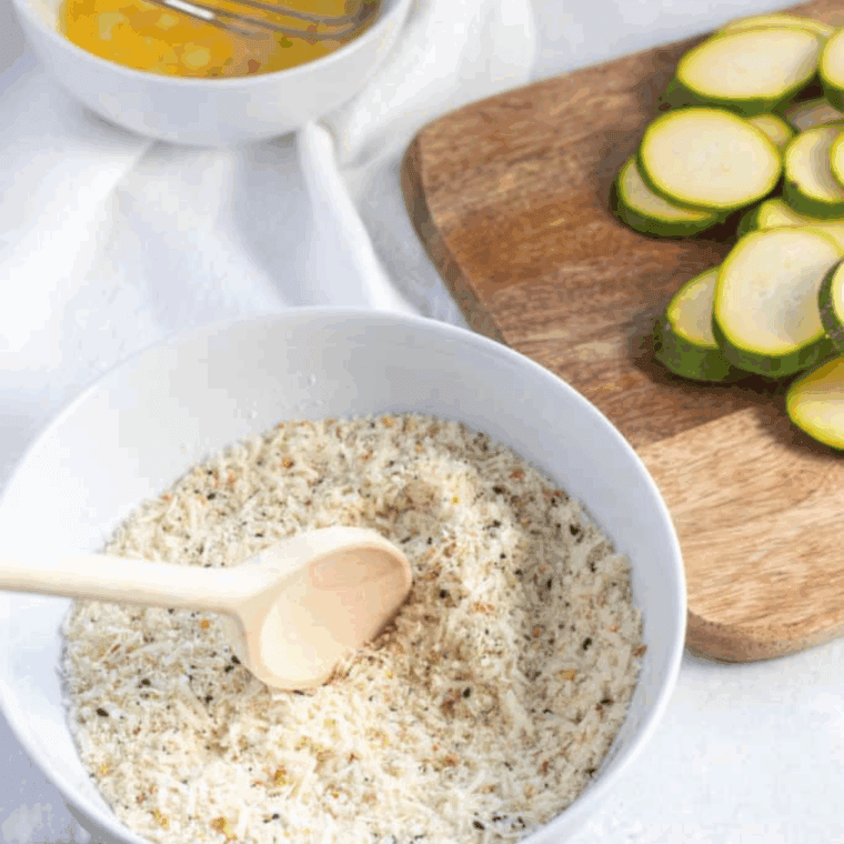 Preparing the coating for the zucchini crisps.