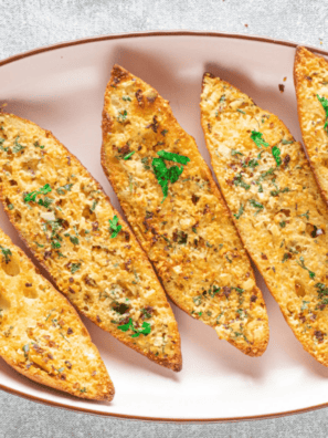 Air fryer garlic bread with fresh herbs, real butter, and parmesan. Crispy outside, soft inside, ready in under 10 minutes &mdash; no preheating needed.