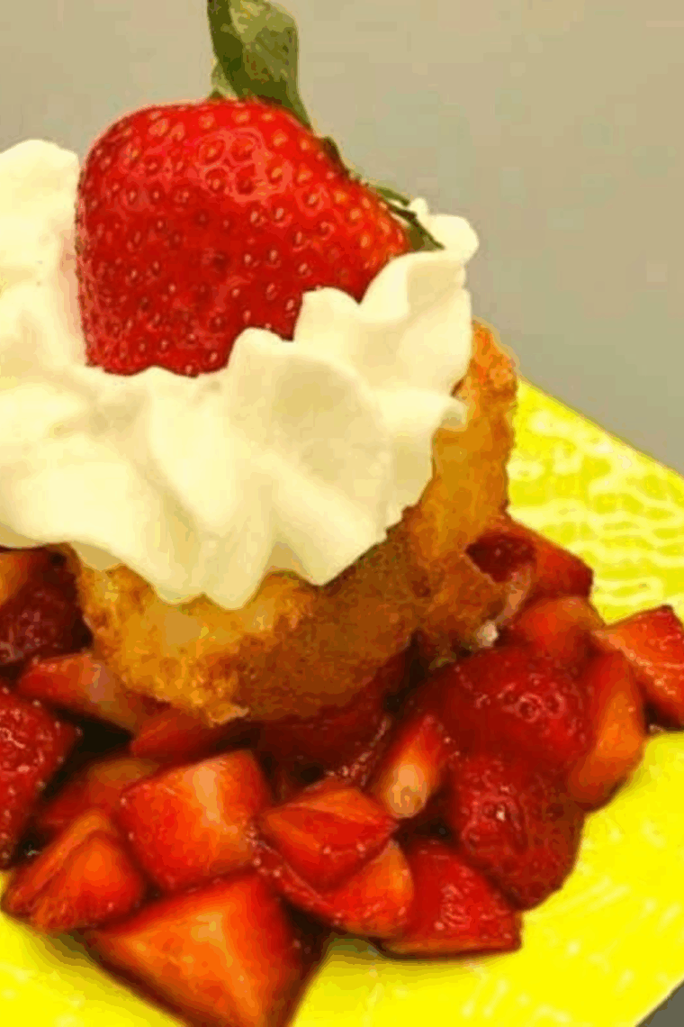 Air fryer grilled angel food cake with fresh strawberries and whipped cream on top.