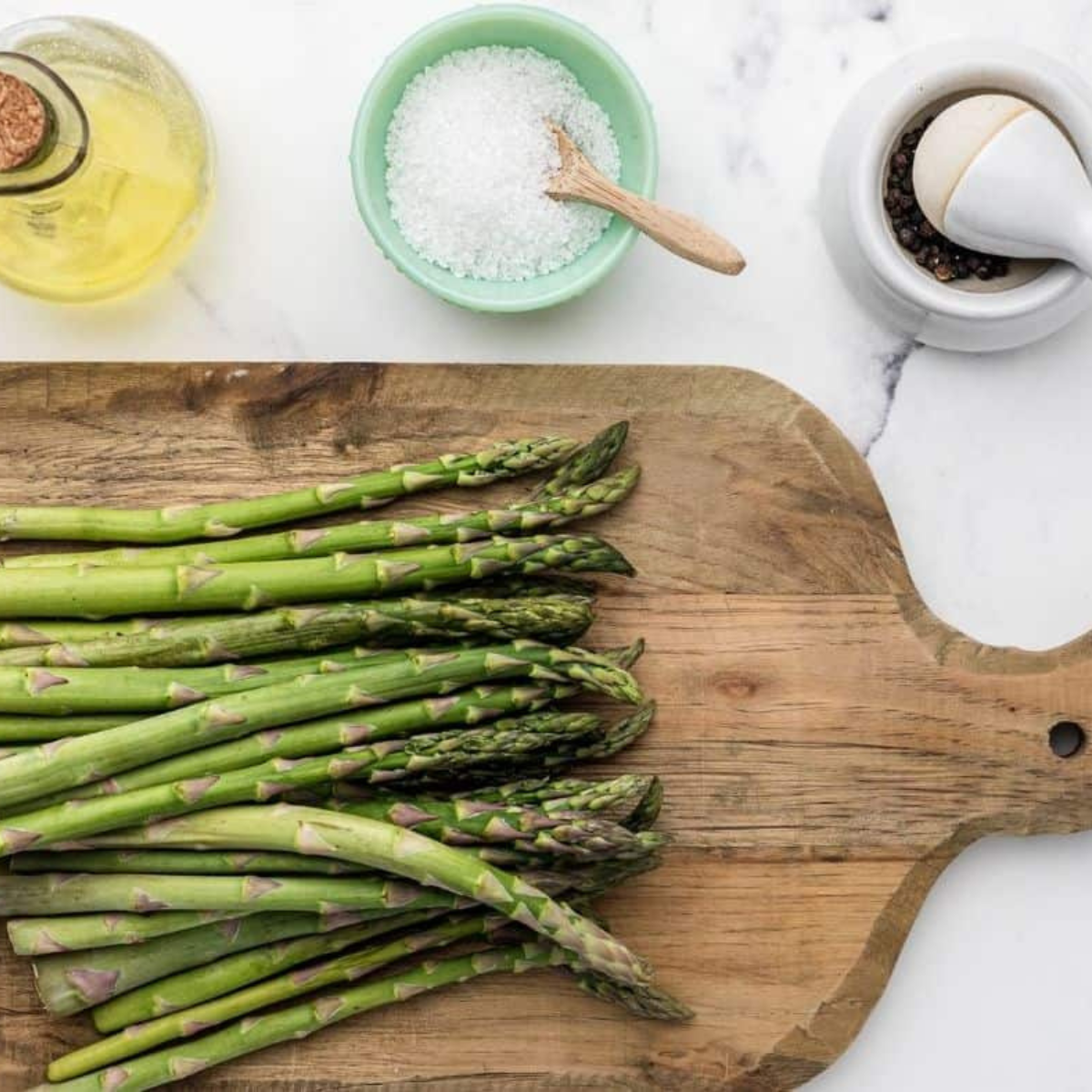 Ingredients needed for Air Fryer Weight Watchers Asparagus on kitchen table.