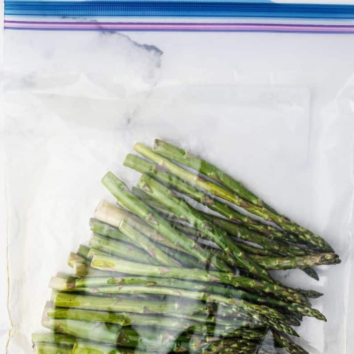 Asparagus Coated with Olive Oil and Seasonings in bag