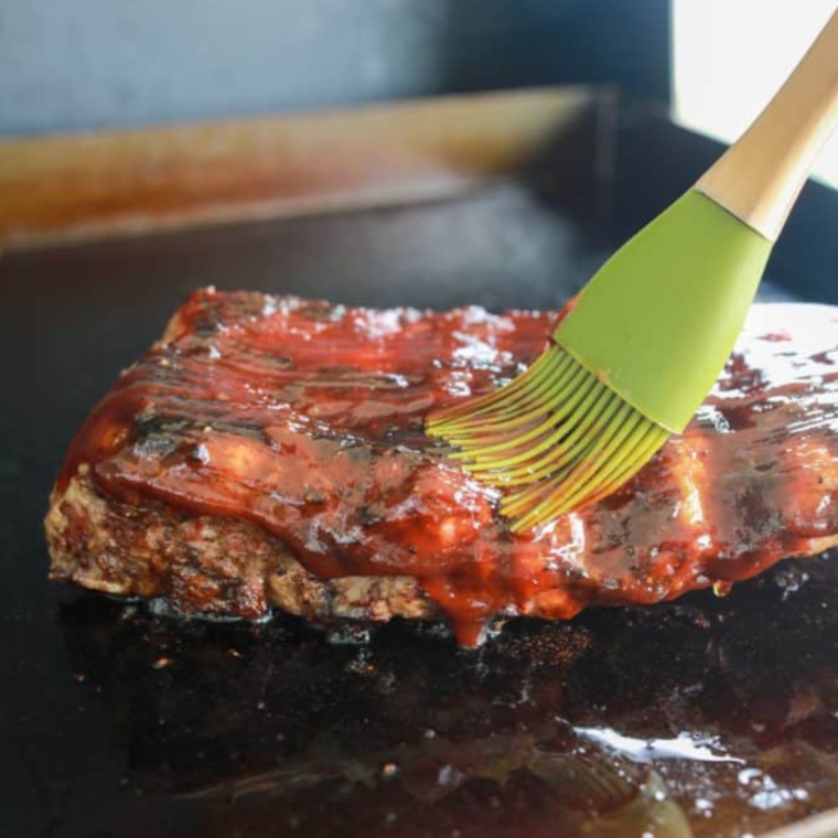 Brush on your favorite BBQ sauce near the end, then let the ribs rest for 10 minutes before serving.