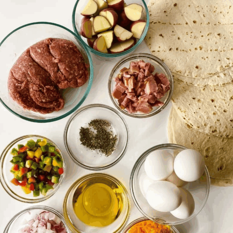 Ingredients needed for Copycat Burger King Egg-Normous Breakfast Burrito Recipe on kitchen table.