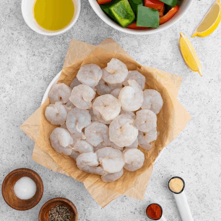 Ingredients needed for Copycat Cheesecake Factory Shrimp Scampi on kitchen table.