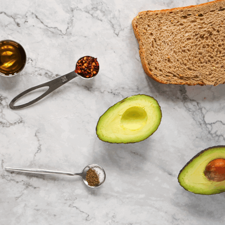 Ingredients needed for Air Fryer Grated Egg & Avocado Toast on kitchen table.