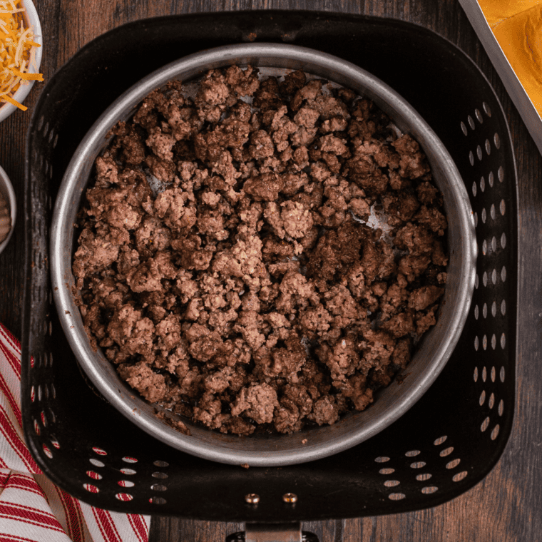 overhead: cooked ground beef in air fryer basket