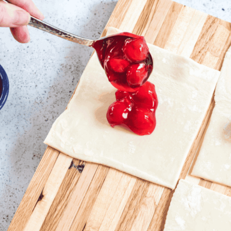 Add cherry filling to the center of the puff pastry (Thawed).