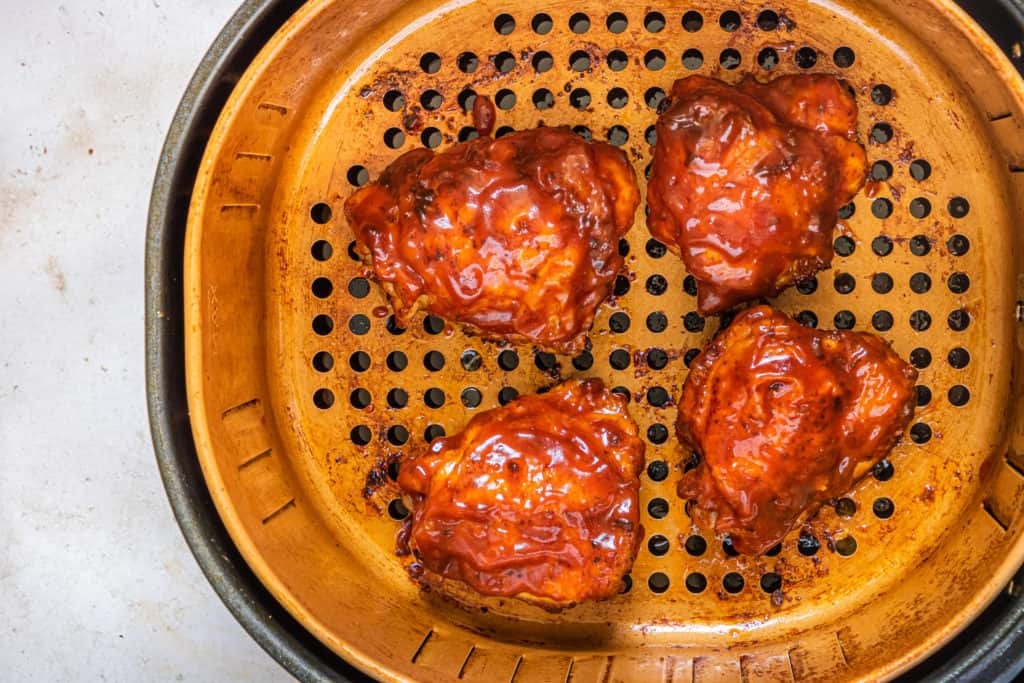 Air Fryer BBQ Chicken Thighs in Air Fryer Basket