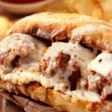 For Best Results: Place the meatballs into the sub roll, sprinkle with cheese, and either use a broiler or an air fryer and melt the cheese.
