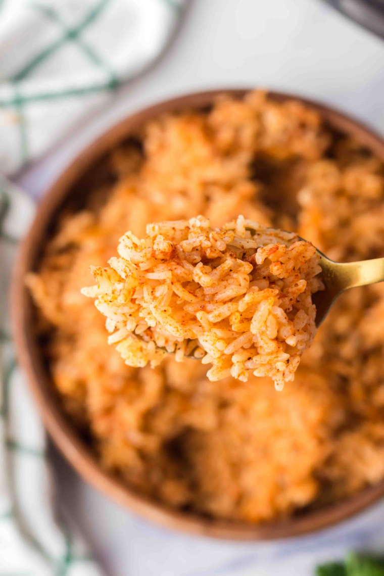 Instant Pot Spanish rice cooked evenly with bold spices and tomato flavor for quick easy side dish for dinner