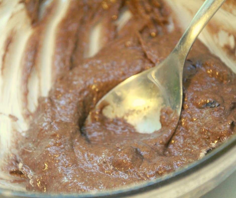 Mug Cake Batter in Bowl, being mixed by spoon