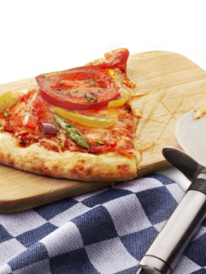 Reheated pizza sitting on wooden cutting board.