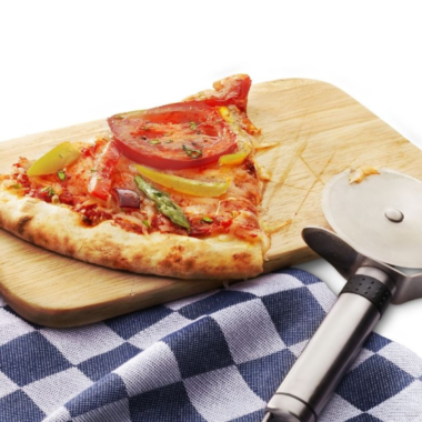 Reheated pizza sitting on wooden cutting board.