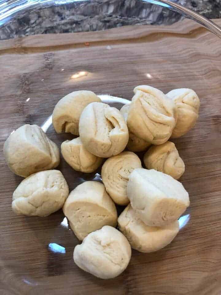 Cut Up Biscuit Dough in Bowl