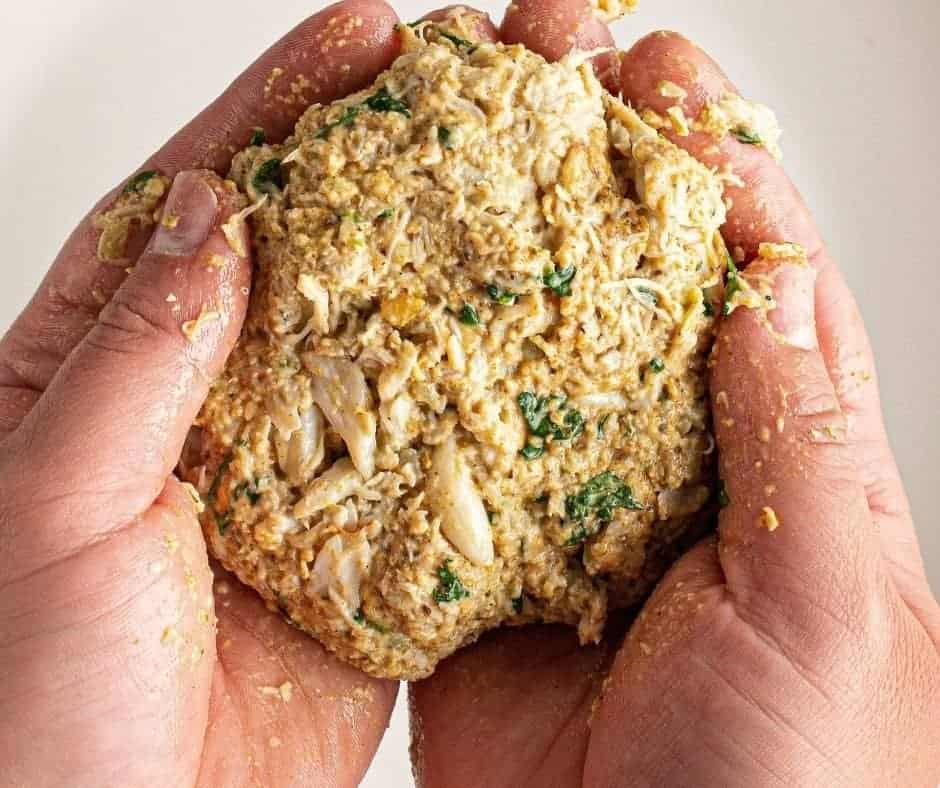 forming crab cake in hands