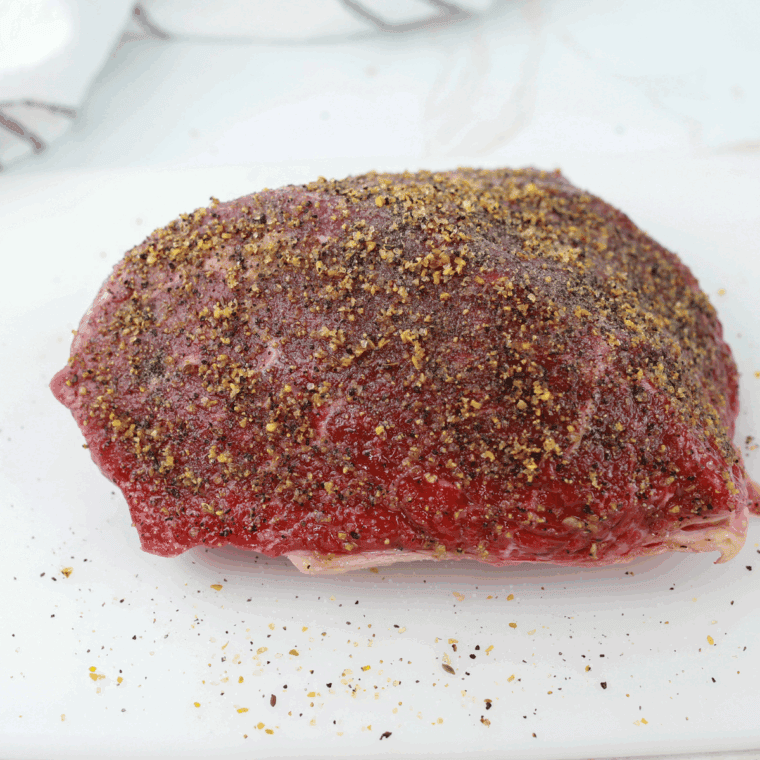 Season the roast beef.