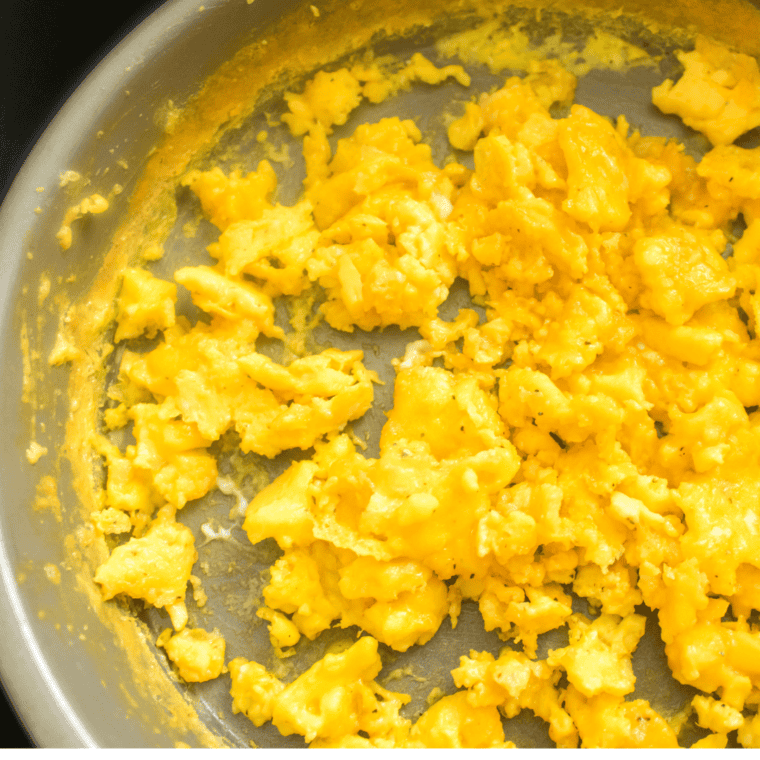 round metal pan filled with scrambled eggs