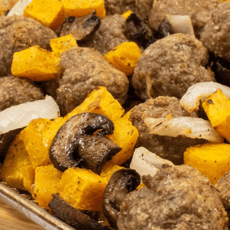 Platter of Air Fryer Turkey Sausage Meatballs and Squash, showing the caramelized squash and browned turkey meatballs.