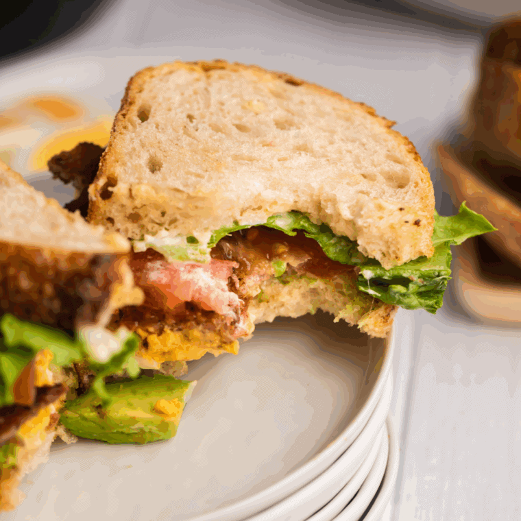 Air fryer Arby’s Brown Sugar Bacon BLT with caramelized bacon, lettuce, and tomato on golden toasted bread.
