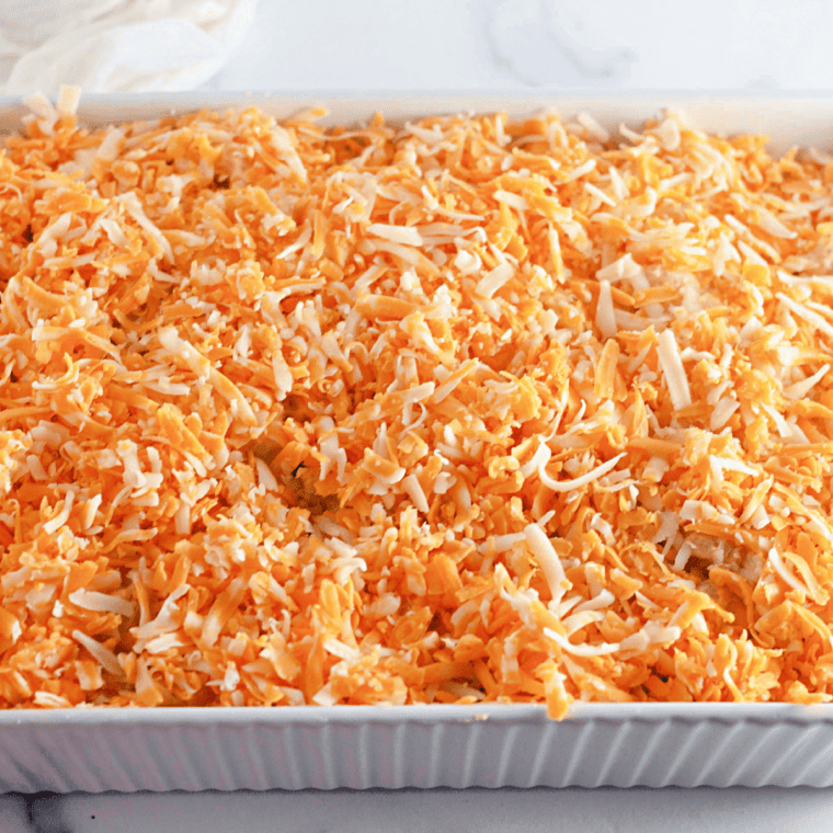 Copycat Costco mac and cheese in a 9x13 baking dish topped with reserved shredded cheddar