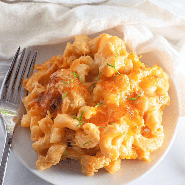 Homemade copycat Costco mac and cheese in a baking dish with creamy cheddar cheese sauce and pasta