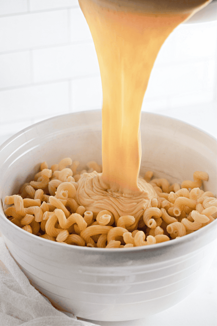Cooked cavatappi folded into the creamy cheese sauce for copycat Costco mac and cheese