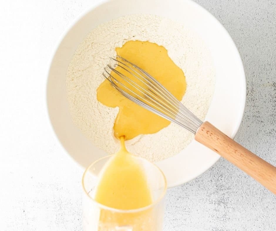 Mix the batter in a large white mixing bowl. Using a whisk.