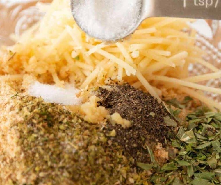 closeup: mixing parmesan, breadcrumb, and herb topping for parmesan tomatoes in air fryer