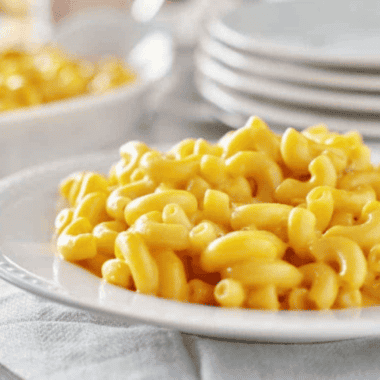 Copycat Costco mac and cheese with creamy cheddar sauce and elbow macaroni in casserole dish