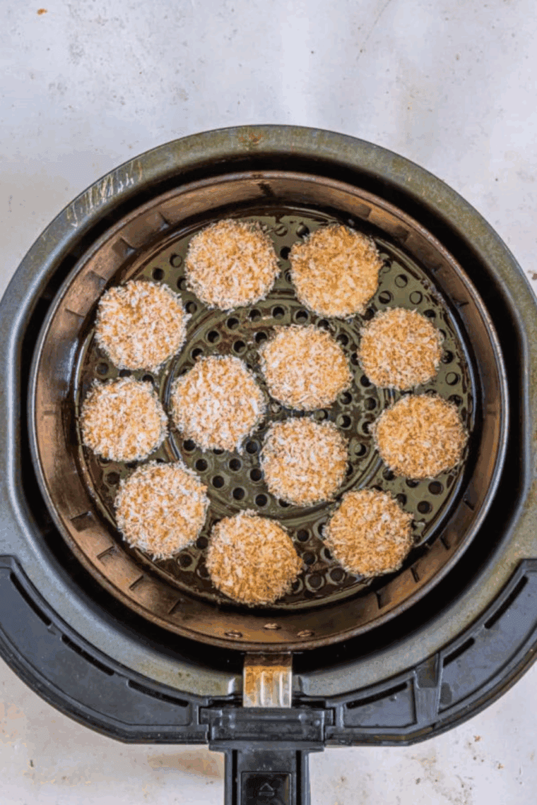 Place coated zucchini into the air fryer basket.