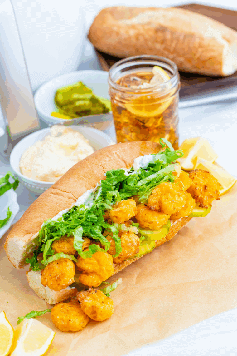 Homemade Arthur Treacher’s Po Boy Sandwich with crispy fish and fresh toppings on a toasted bun.