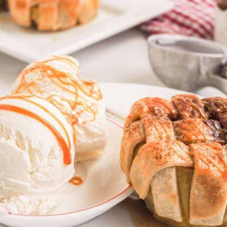 Air Fryer Apple Pie Baked Apples topped with a cinnamon-sugar crust, ready to enjoy.