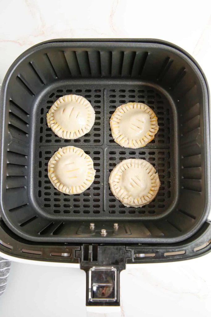 Air Fryer Apple Cheddar Pies In Air Fryer Basket