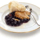 Air Fryer Blueberry Cobbler -- Are you trying to find a delicious and easy dessert recipe? This Air Fryer Blueberry Cobbler is the perfect treat for any occasion! You won't believe how fast and simple it is to make: all you need are a few basic ingredients, the air fryer, and less than 25 minutes.