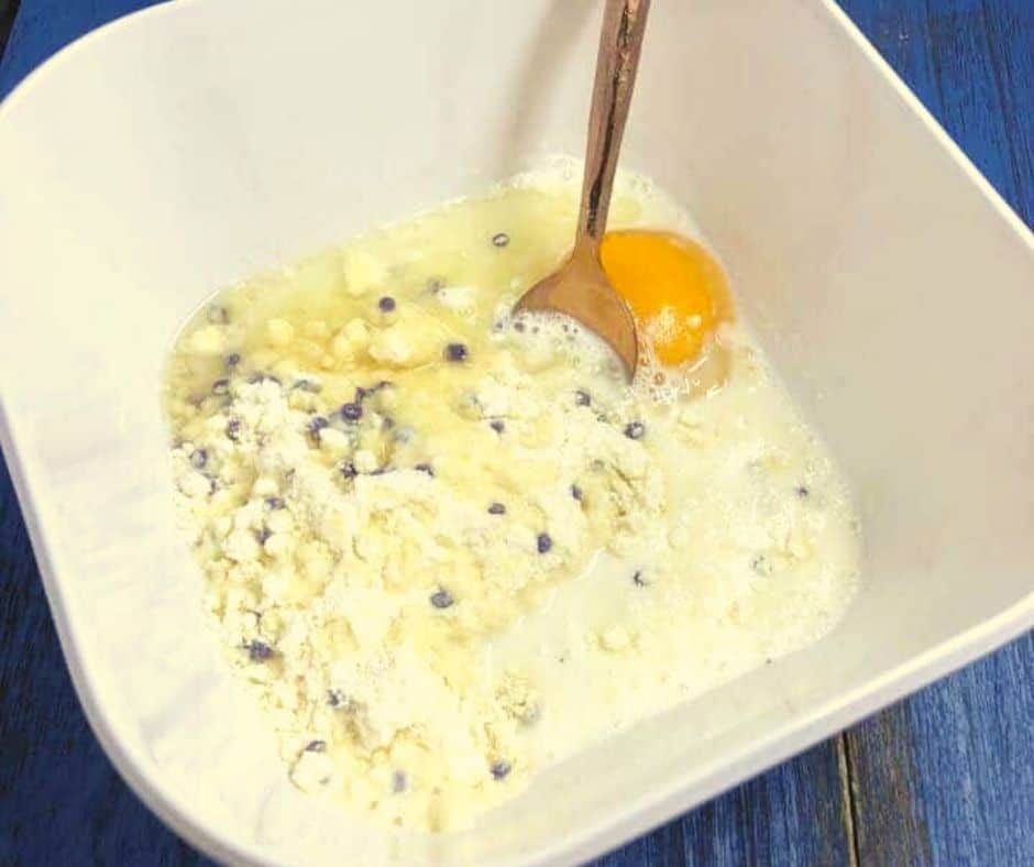 Mix the egg, milk, mix, and oil together.  Then fold in 1/2 cup of blueberries (optional)