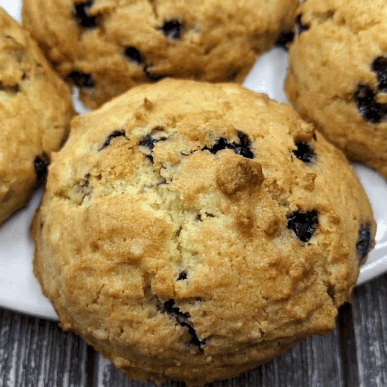 Soft and chewy blueberry cookies baked in an air fryer, golden and loaded with fresh blueberries.