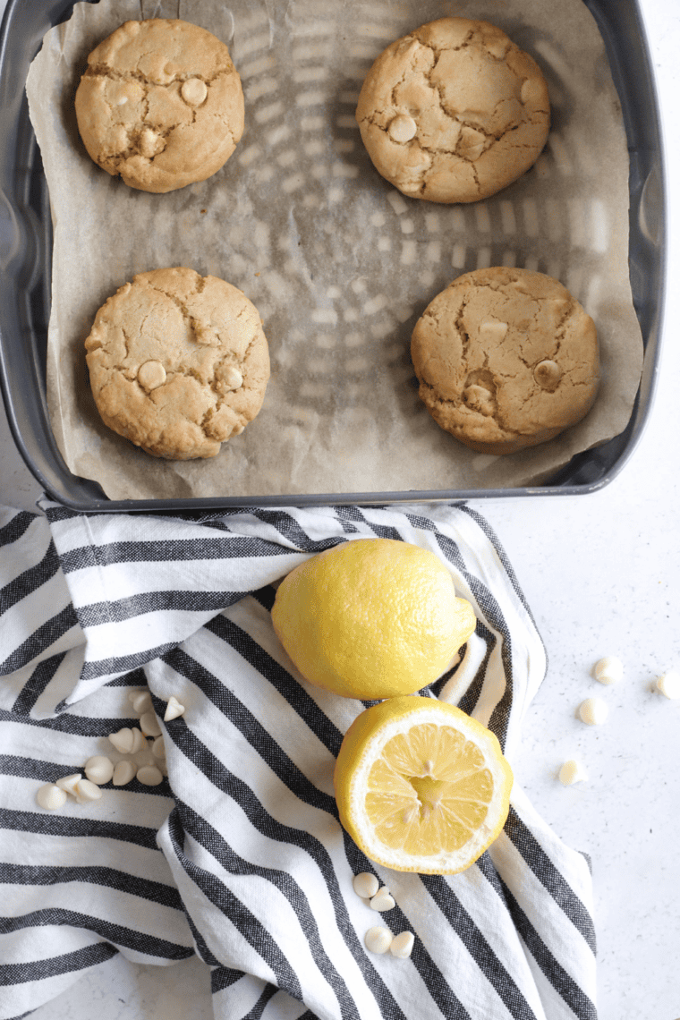 Freshly baked white chocolate chip cookies cooling before serving.