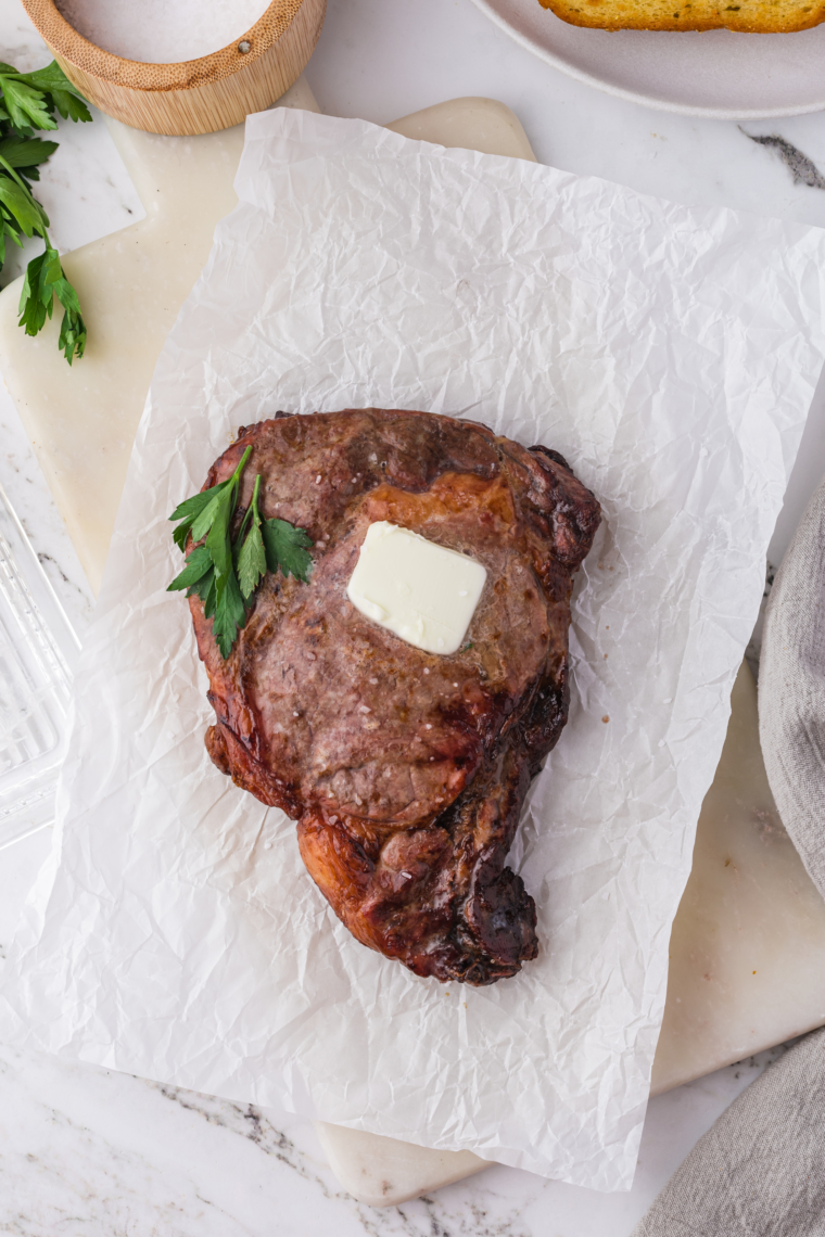 Air fryer ribeye steak served with mashed potatoes and asparagus.