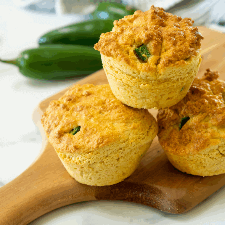 Golden-brown Arthur Treacher’s hush puppies served in a basket lined with parchment paper.
