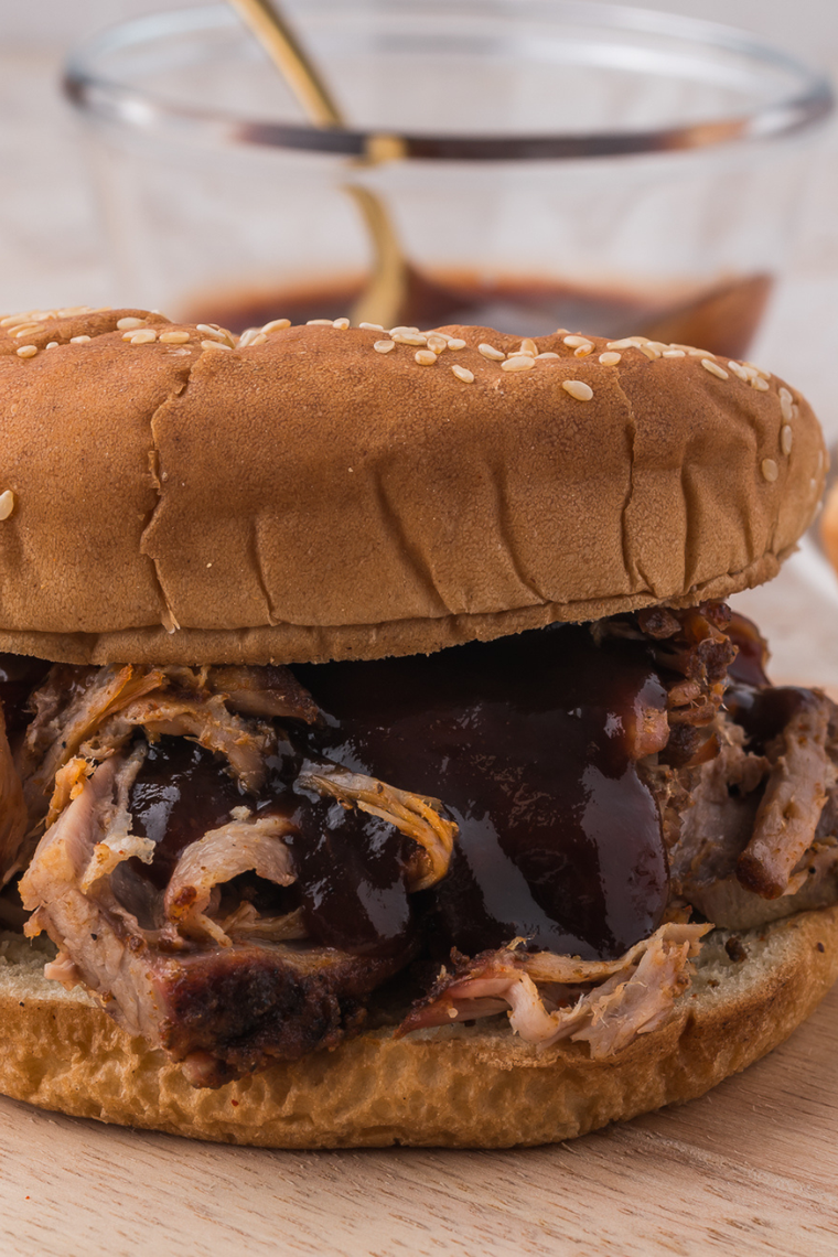 Copycat Mission BBQ pulled pork piled on a toasted brioche bun with coleslaw