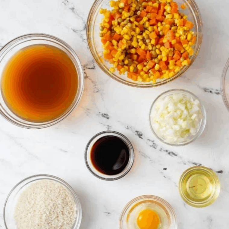 Ingredients needed for Instant Pot Pork Fried Rice on kitchen table.