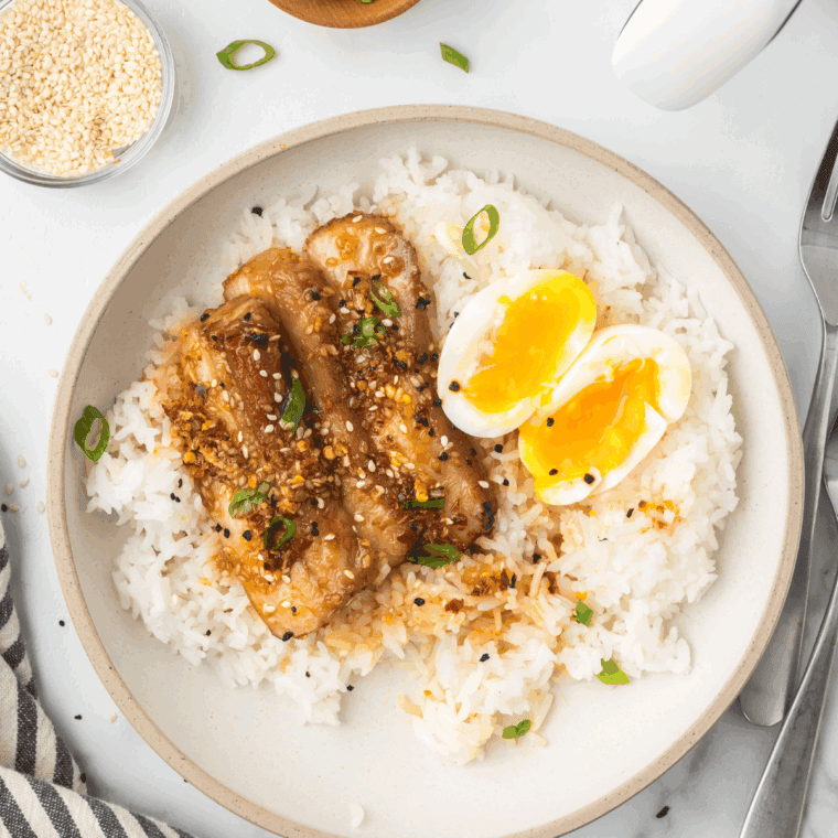 Fluffy Instant Pot Coconut Jasmine Rice served in a bowl, garnished with herbs.
