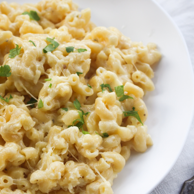 Creamy Instant Pot Panera-style mac and cheese served in a bowl, showcasing a rich, cheesy texture and comfort food appeal."