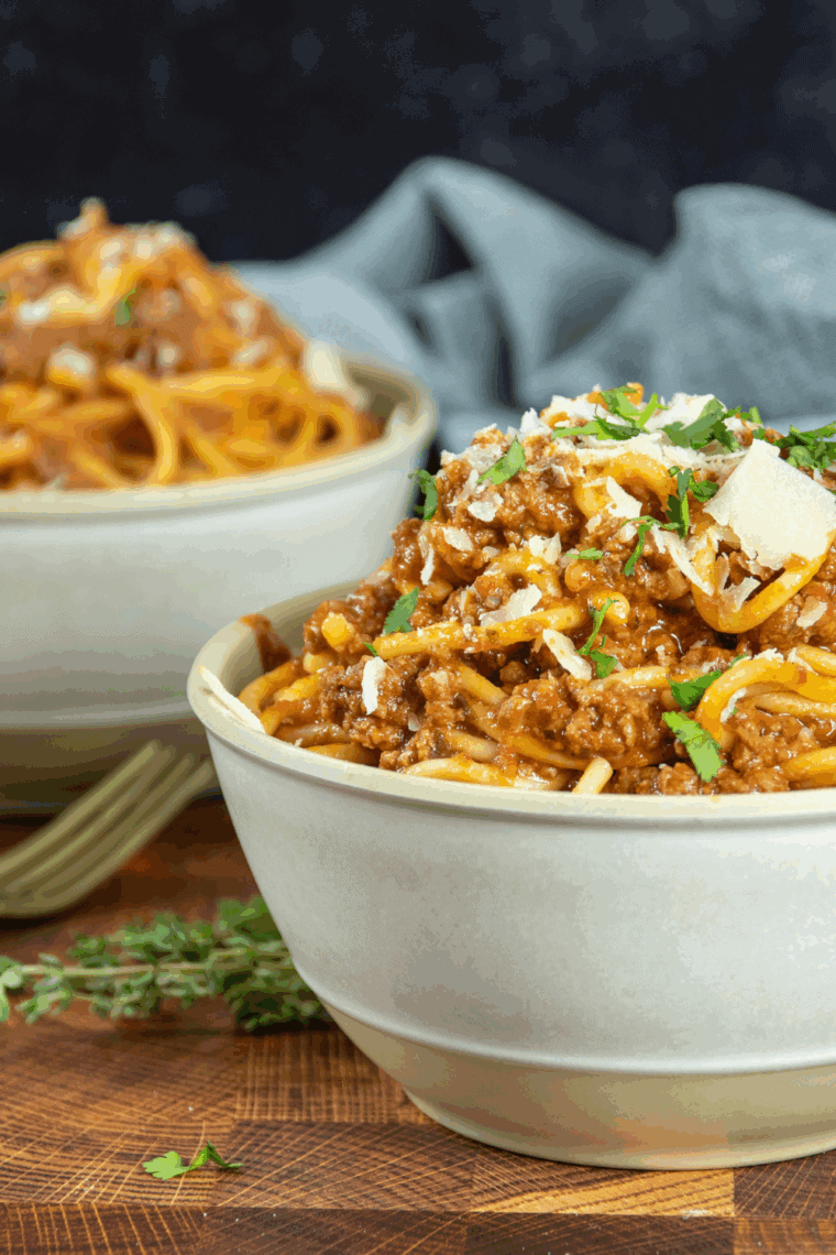Rich, homemade Instant Pot Rao’s Marinara Copycat Sauce served in a white bowl with a spoon, ready for pasta or pizza.