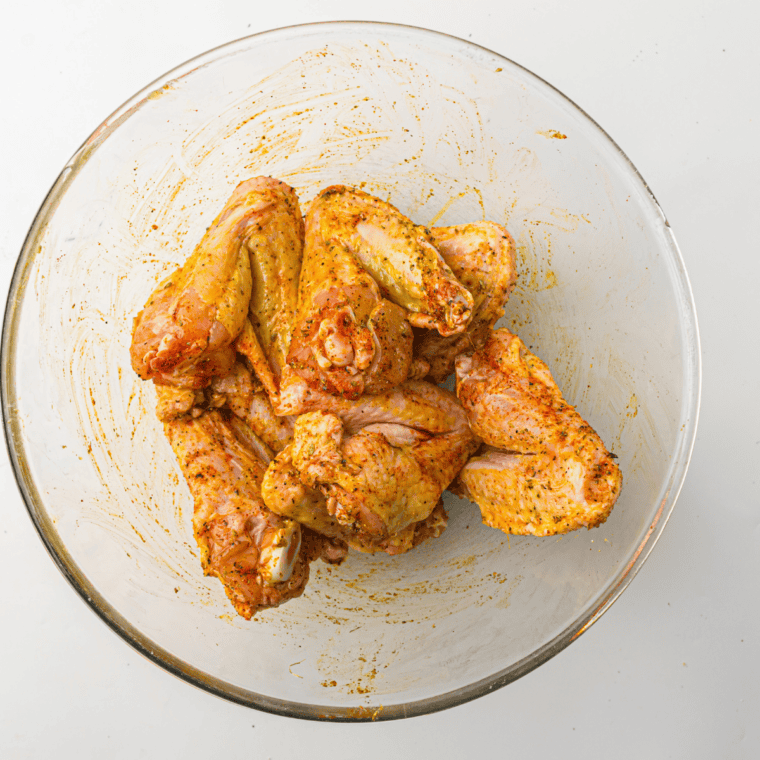 Chicken wings air frying in the Ninja Crispi glass container at 400&deg;F