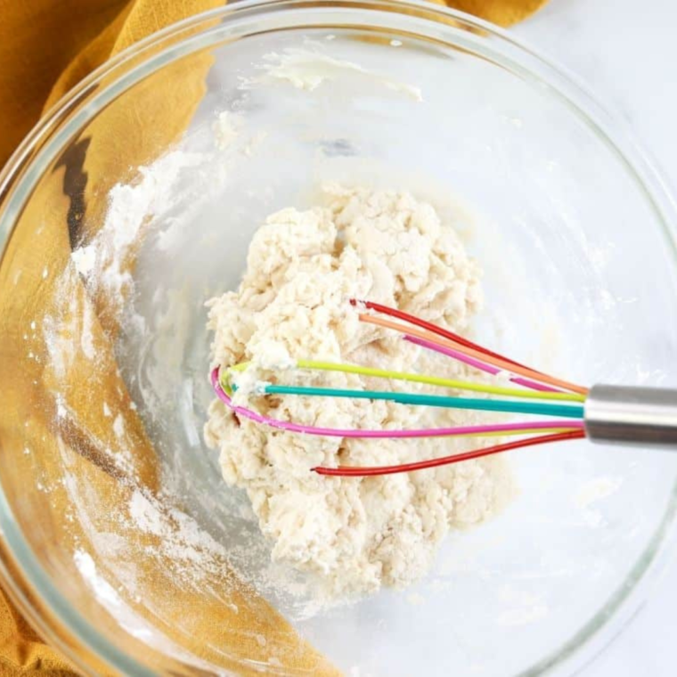 Shaping the everything bagel dough into rings for air frying